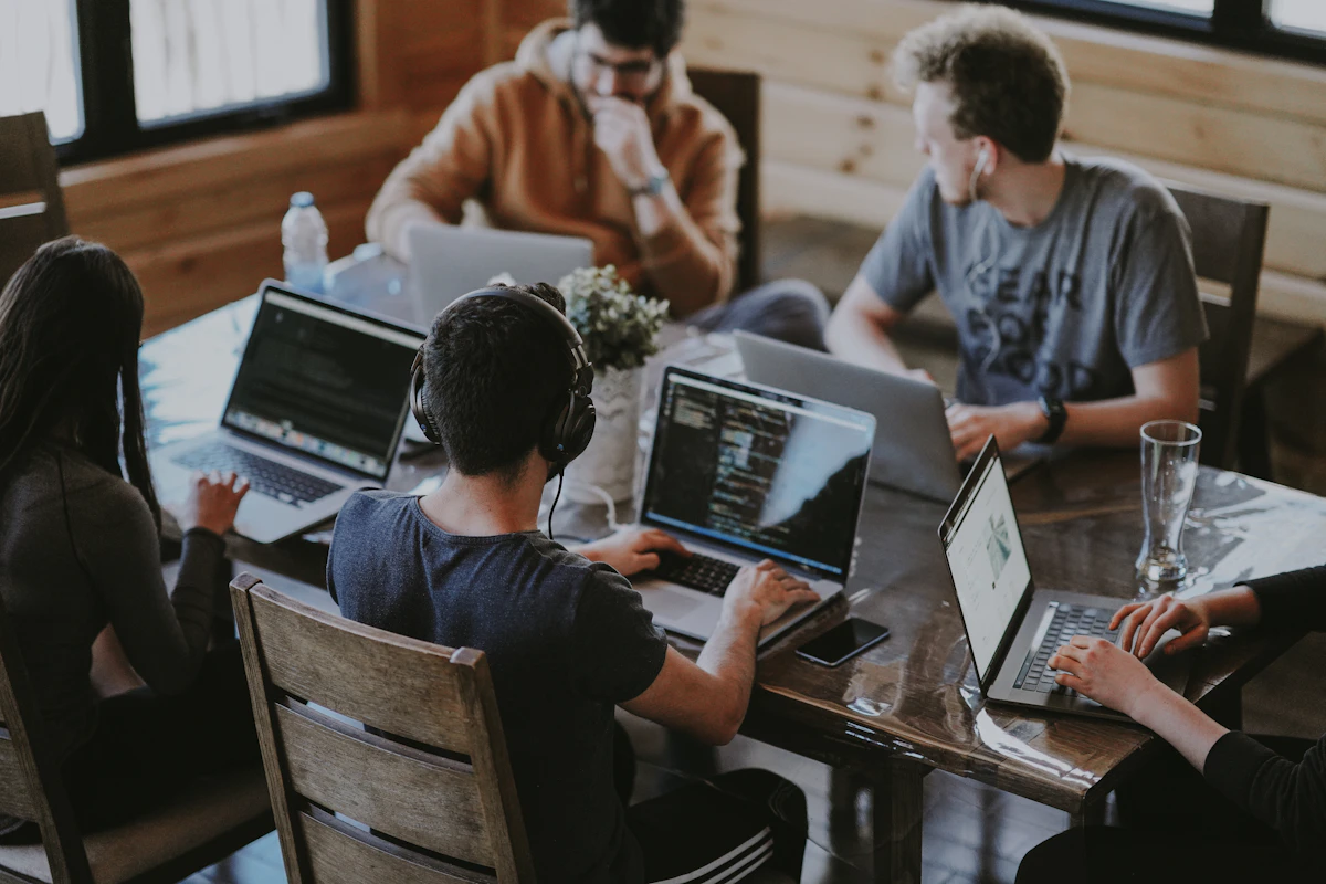 Small business team collaborating on a laptop